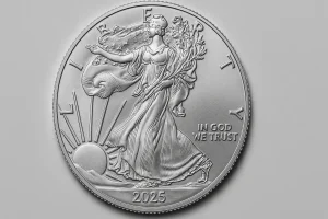 A 1 oz American Silver Eagle coin featuring Liberty in motion and the year 2025, captured in silver detail.